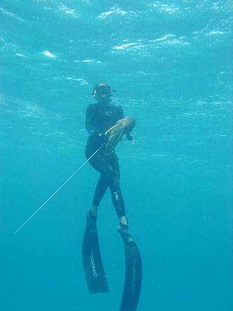 Sheri Daye brings up a yellowfin grouper